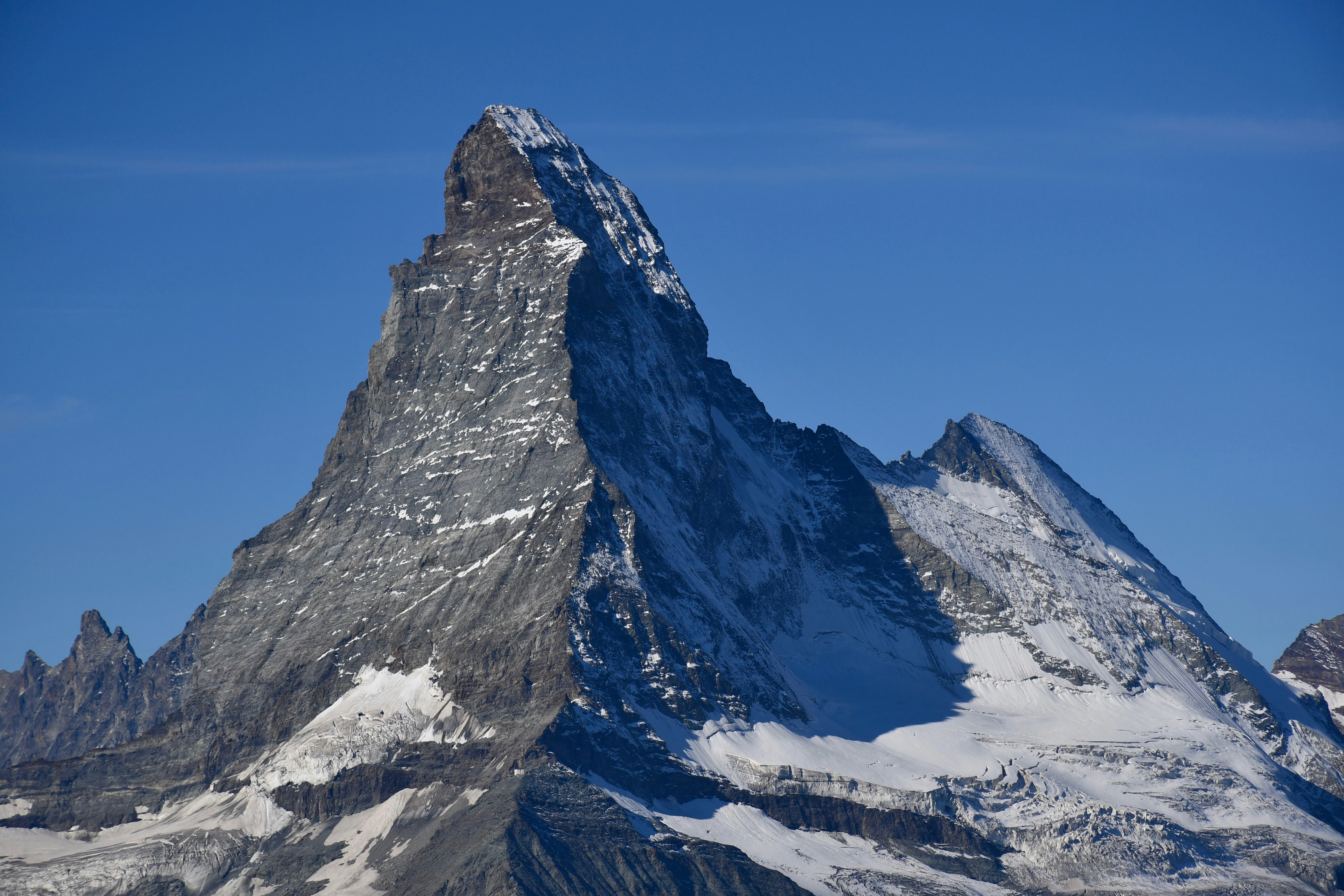 snow covered mountain under blue sky during daytime